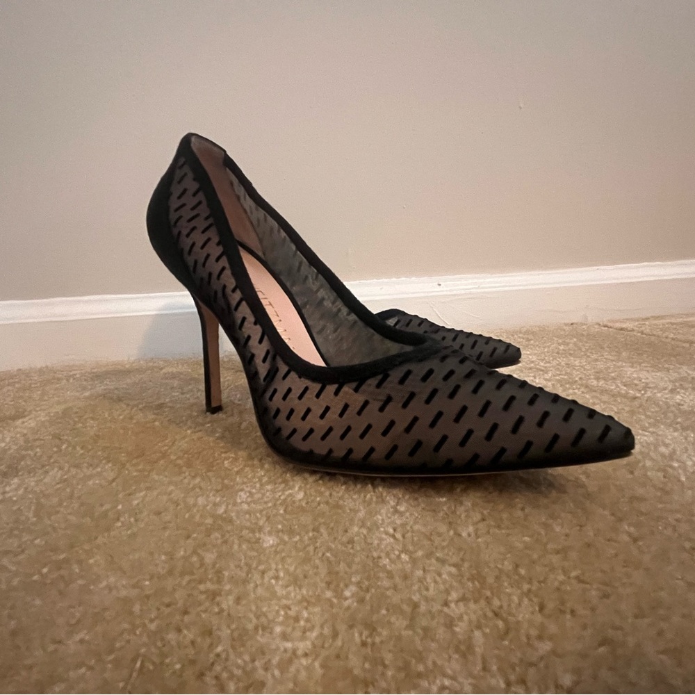 Stuart Weitzman heels. Transparent with black rectangles.
